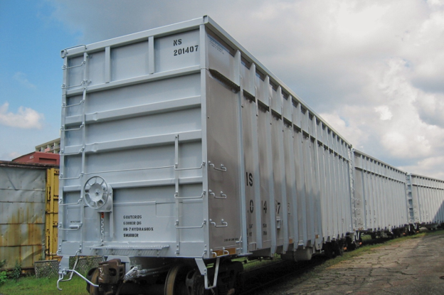 Remanufactured NS 201407 Waste-Gon cars in outdoor rail yard